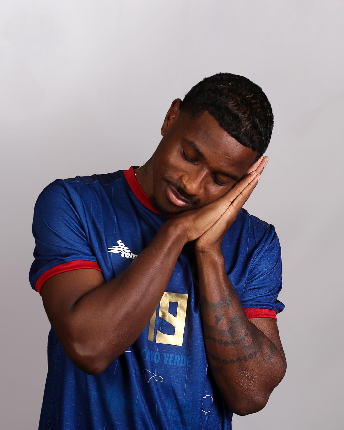 Cape Verde national team player wearing blue home jersey #19