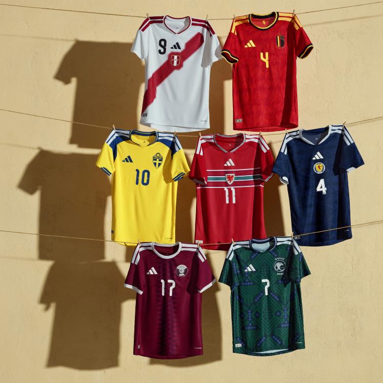 A clean, crisp 2026 jersey hanging on a high-quality wooden hanger in a bright room