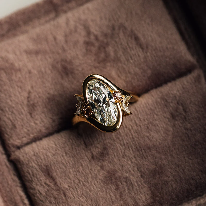 Asymmetric Moon: Oval Cut Engagement Ring