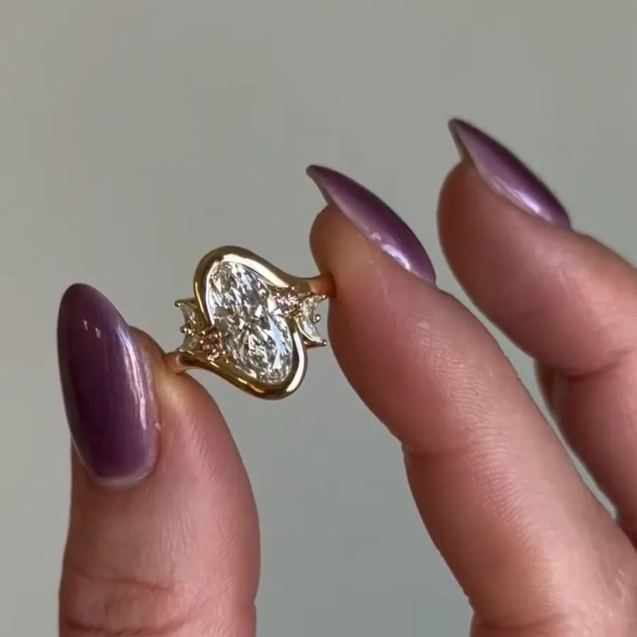 Asymmetric Moon: Oval Cut Engagement Ring