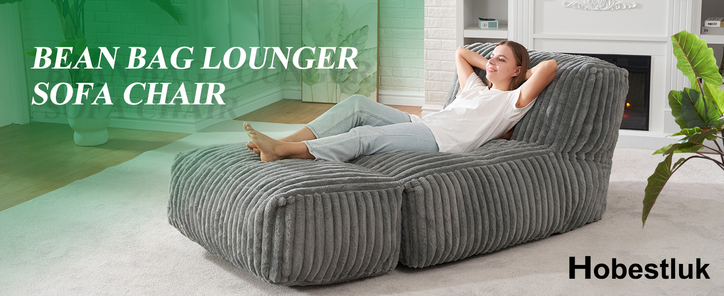 Lying on our grey bean bag lounger sofa