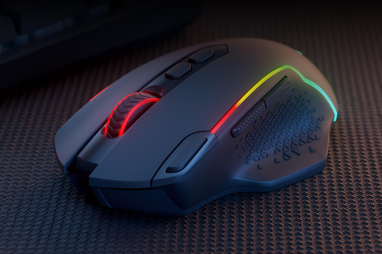 Gaming mouse with RGB lighting on a textured surface
