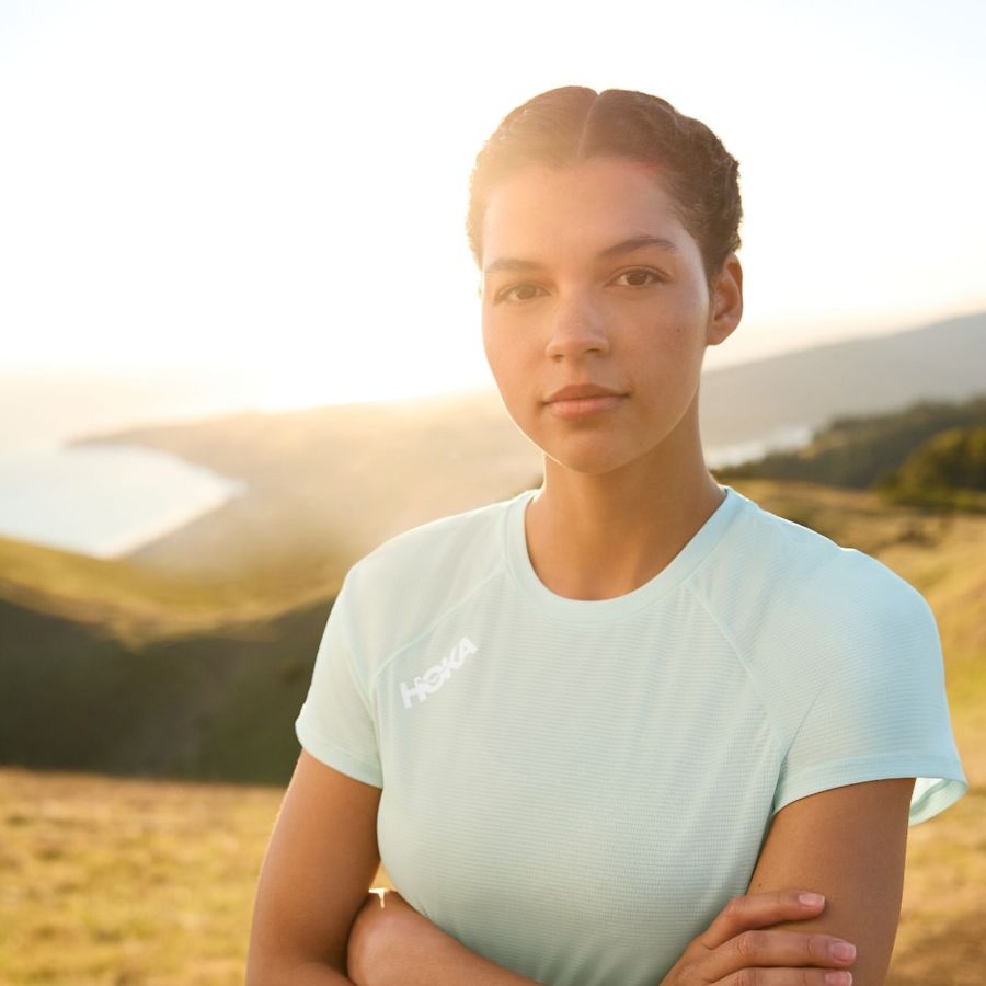 Woman outside looking at camera.