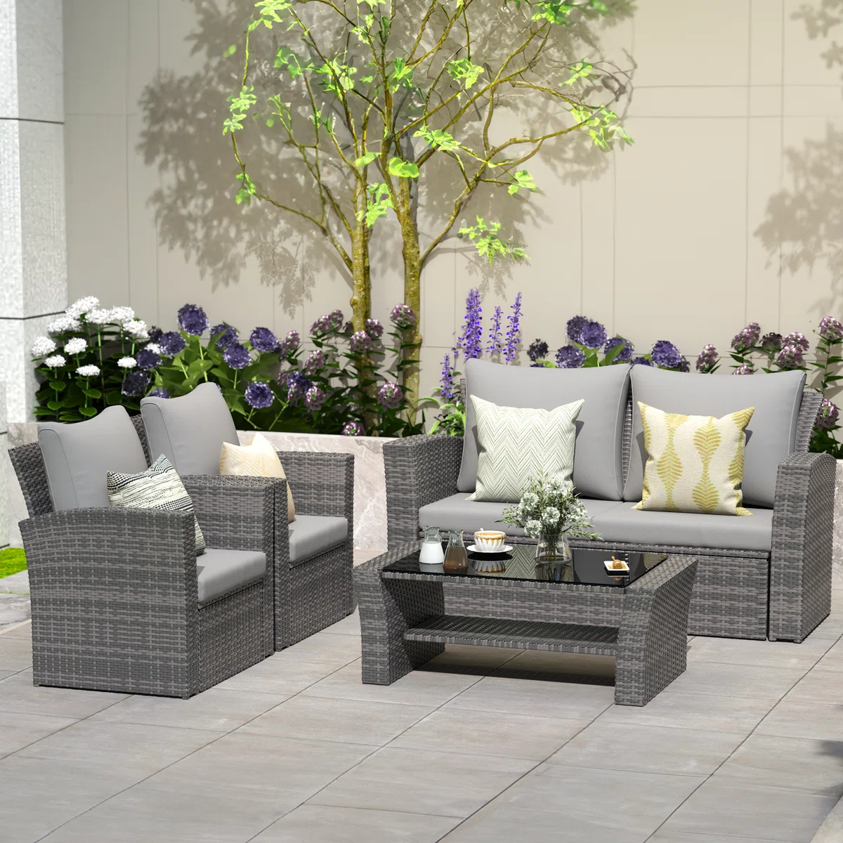 Salon de jardin 4 pièces Capri en résine tressée avec coussins