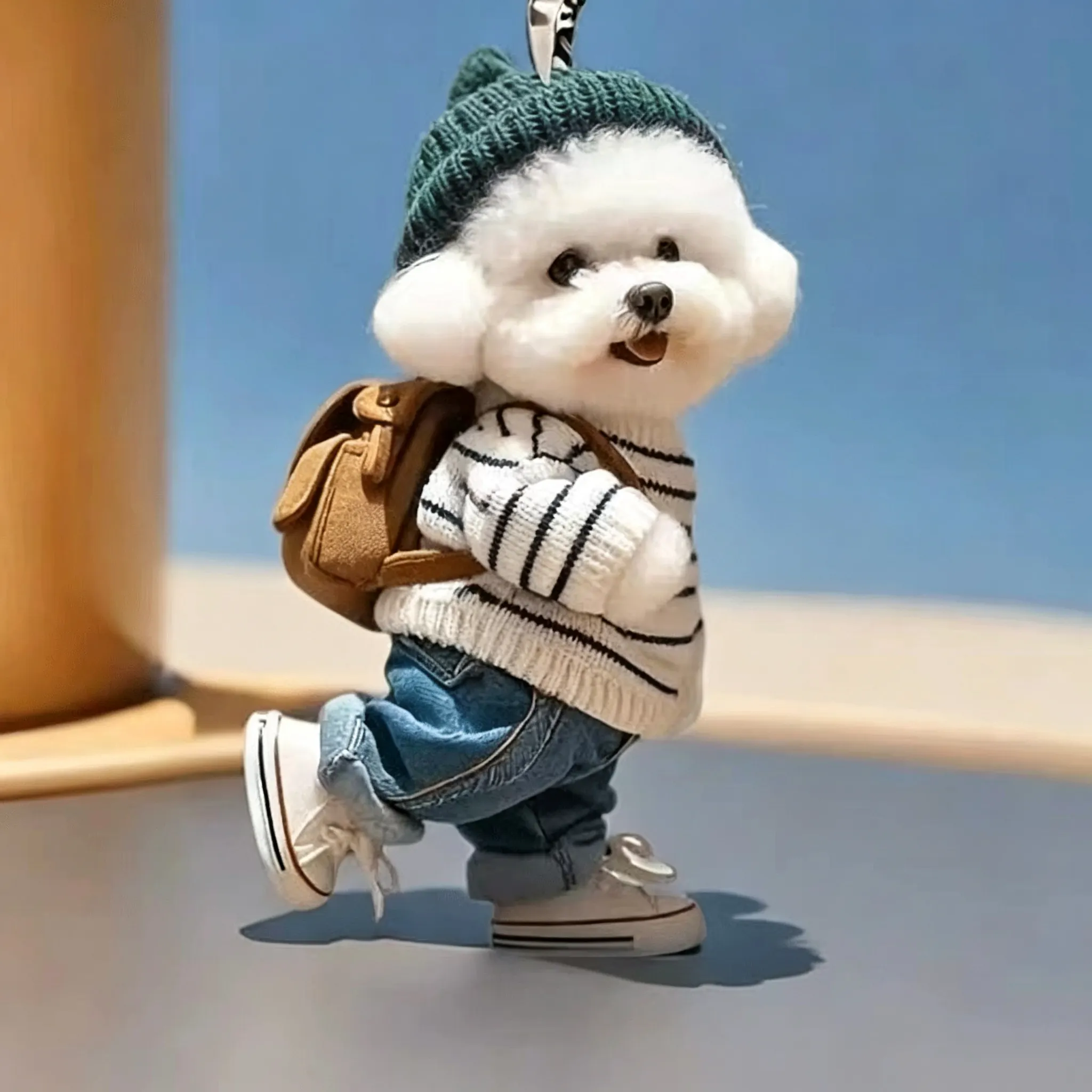 Puppy keychain close-up showing hanging ring and outfit detail