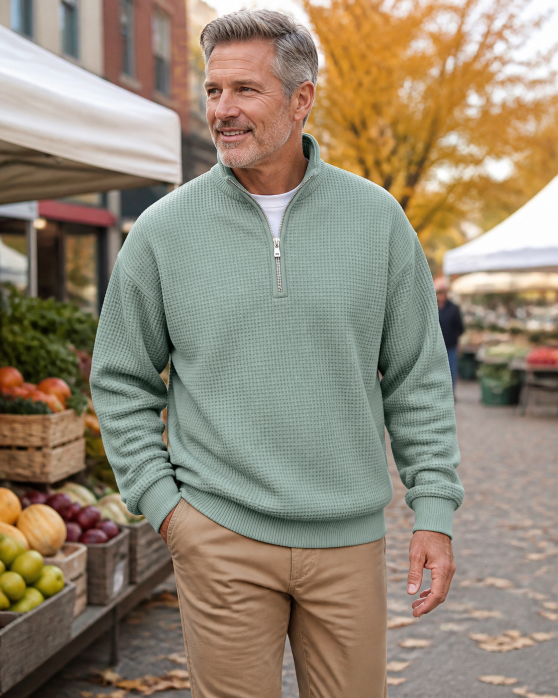 Mature man wearing the Costcrow green waffle-knit half-zip pullover at a farmers market