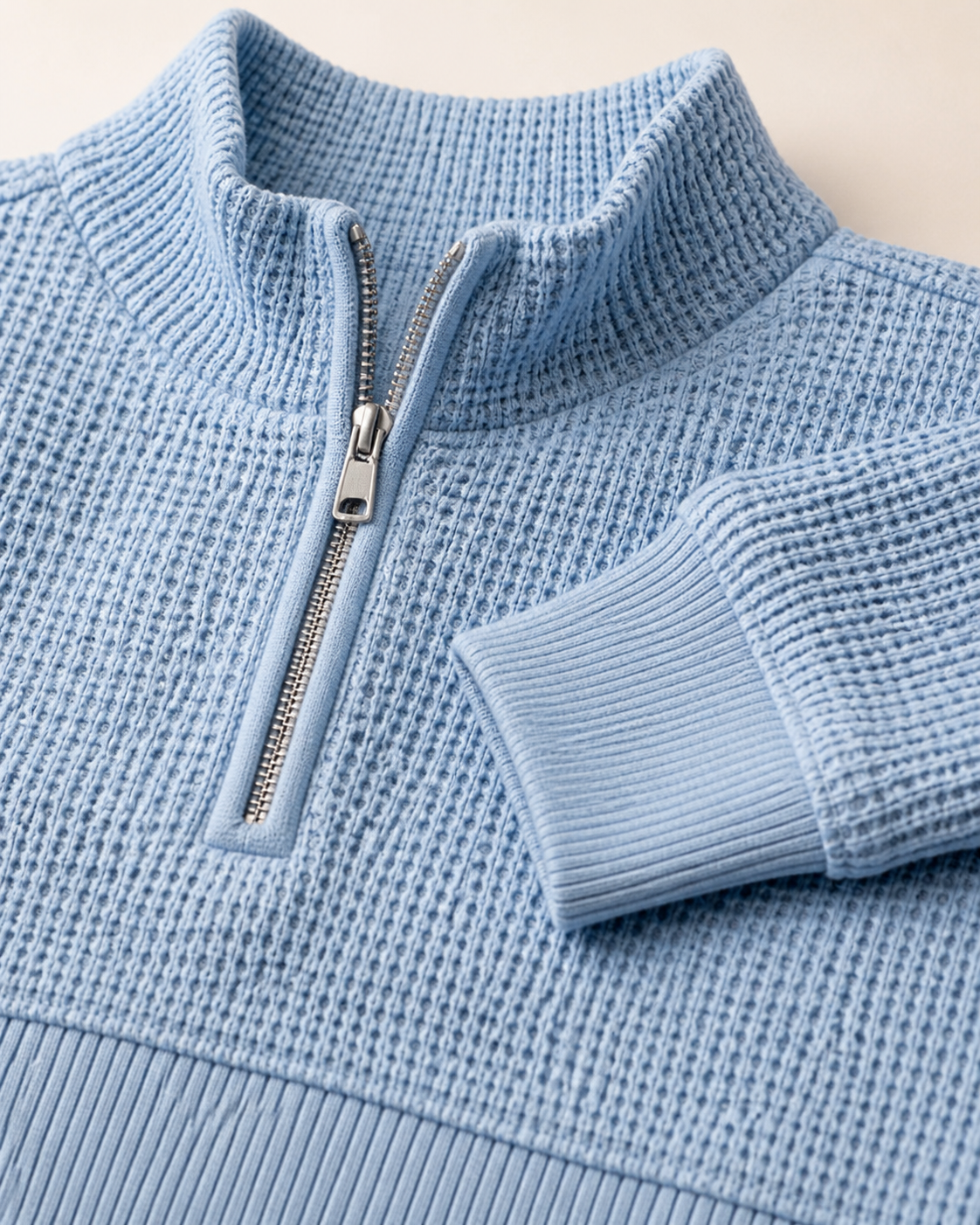 Close-up of the Costcrow waffle texture, half zipper, collar, cuff and hem
