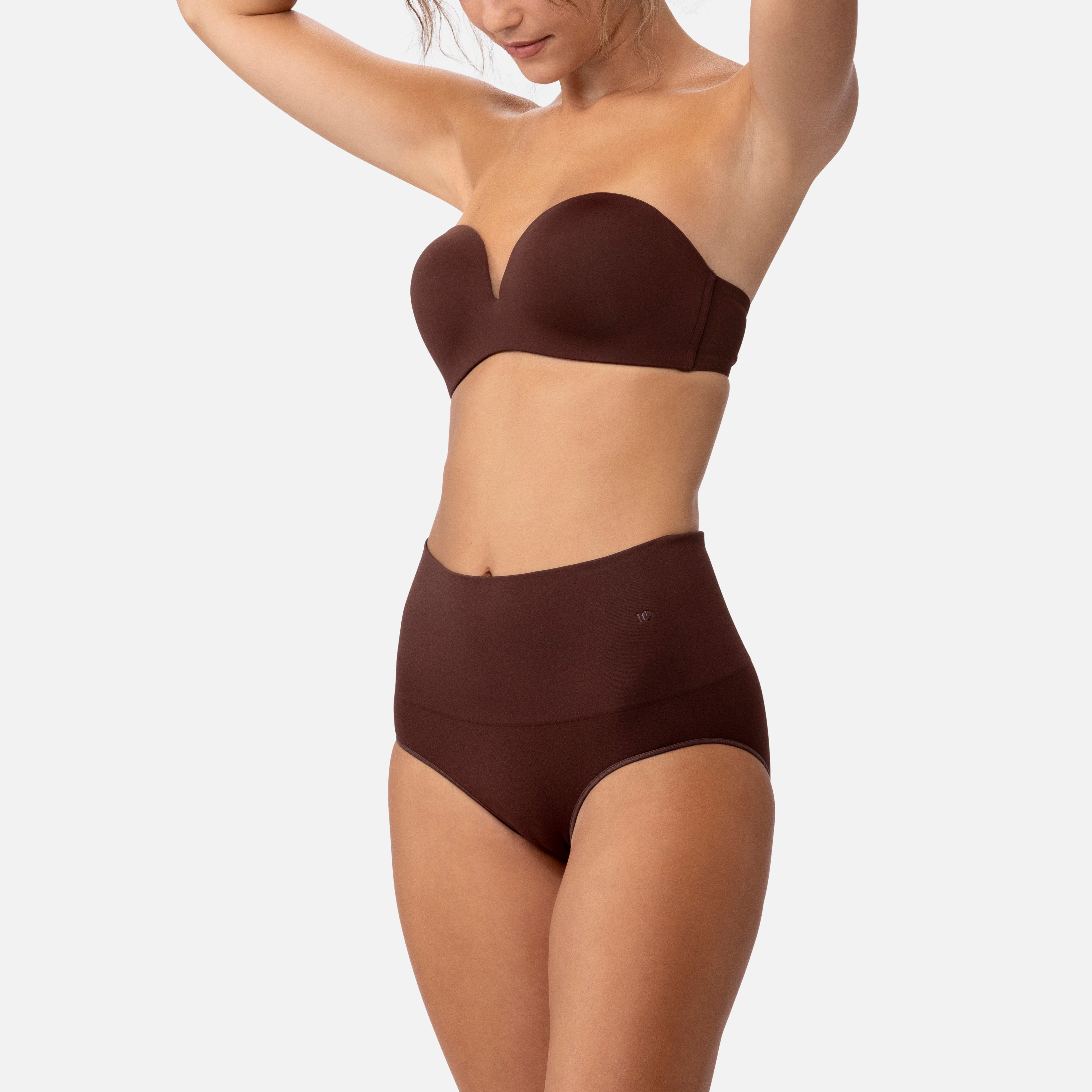 308 Smoothing at Waist Brief &mdash; Chocolate, arms raised lifestyle shot