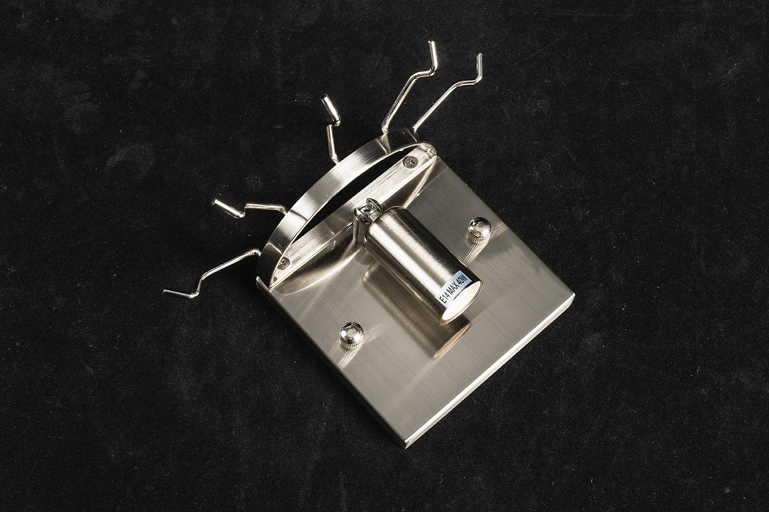 Metal base plate, lamp socket and hanging hooks of the Ondine glass tube wall sconce