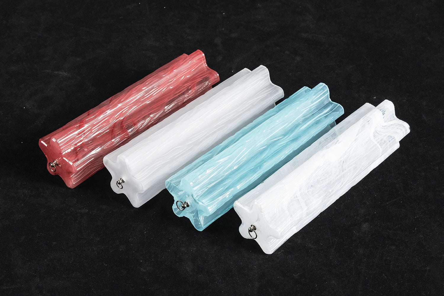 Hand-blown rippled glass tube panels for the Ondine wall sconce in red, white and blue colourways