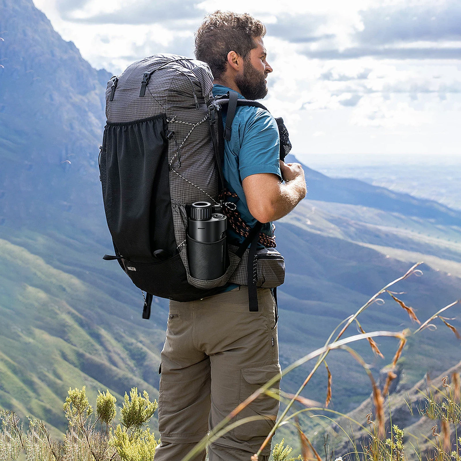 Black and gray checkered ultralight hiking backpack with mesh side pockets and a water bottle on a mountain trail