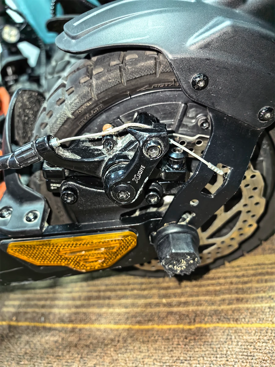 KuKirin G2 Master stock mechanical brake lever close-up before hydraulic brake upgrade