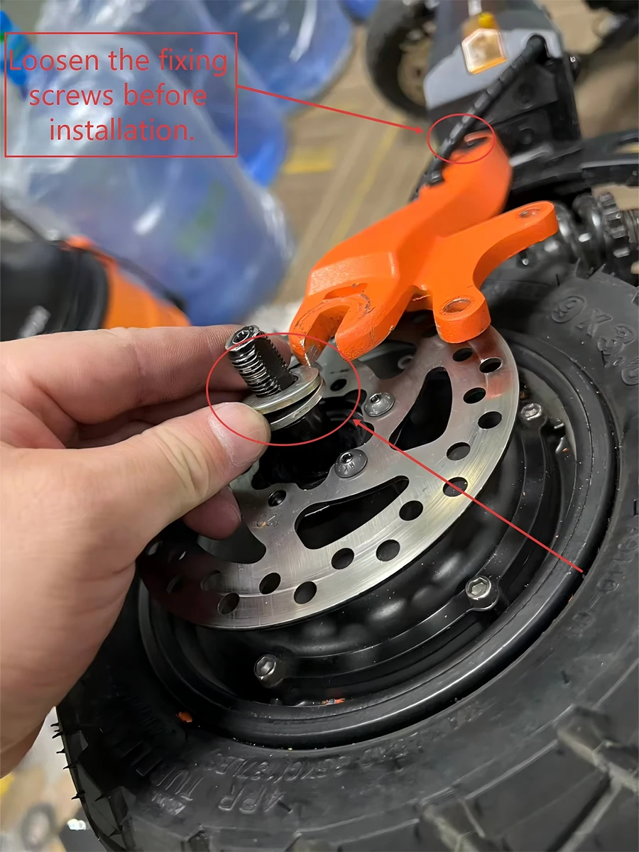 Loosen KuKirin fork fixing screws for hydraulic brake alignment