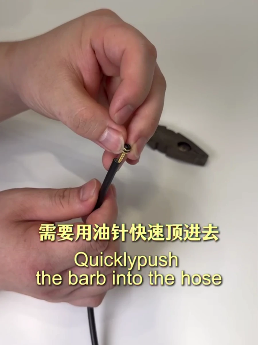 Inserting the hose barb into a shortened XOD hydraulic brake hose