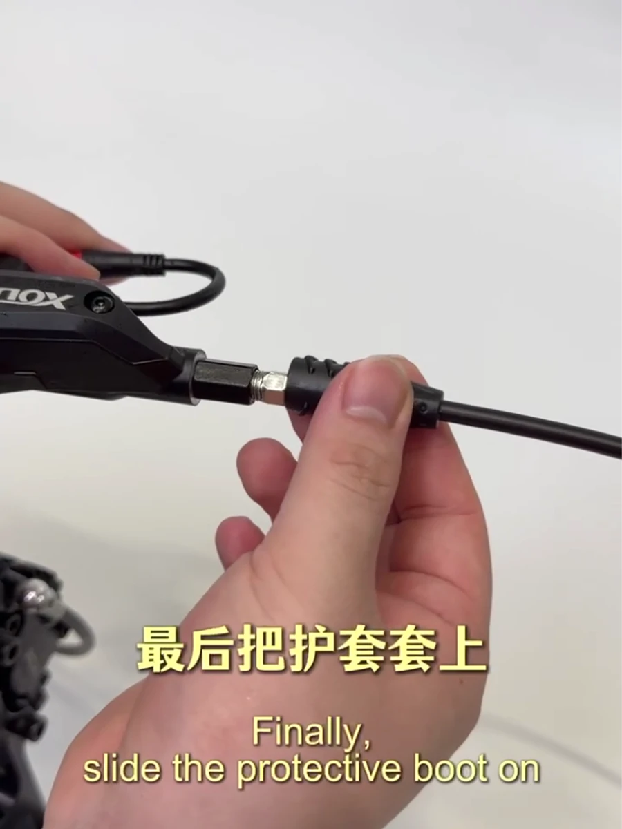 Installing the protective boot after reconnecting an XOD hydraulic brake hose
