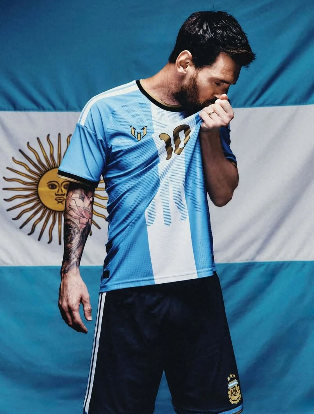 Messi wearing the Argentina special edition 2026 shirt in front of the Argentina flag