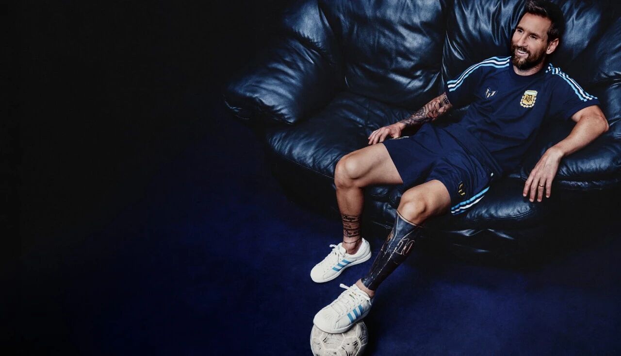 Messi seated wearing the Argentina Messi 2026 night navy track range