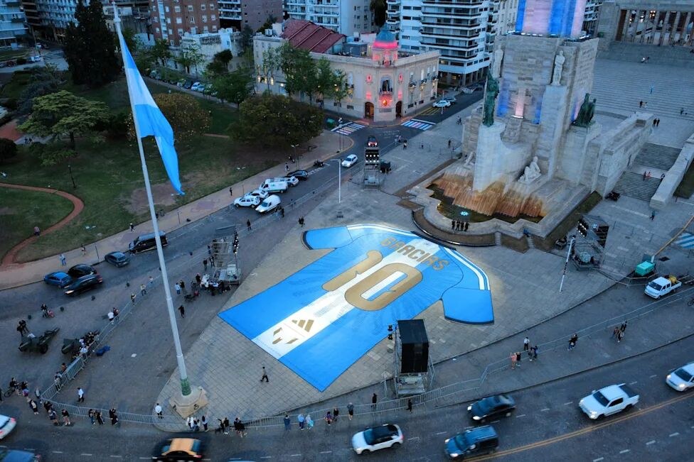 A giant Argentina replica shirt laid out in a city square in Rosario