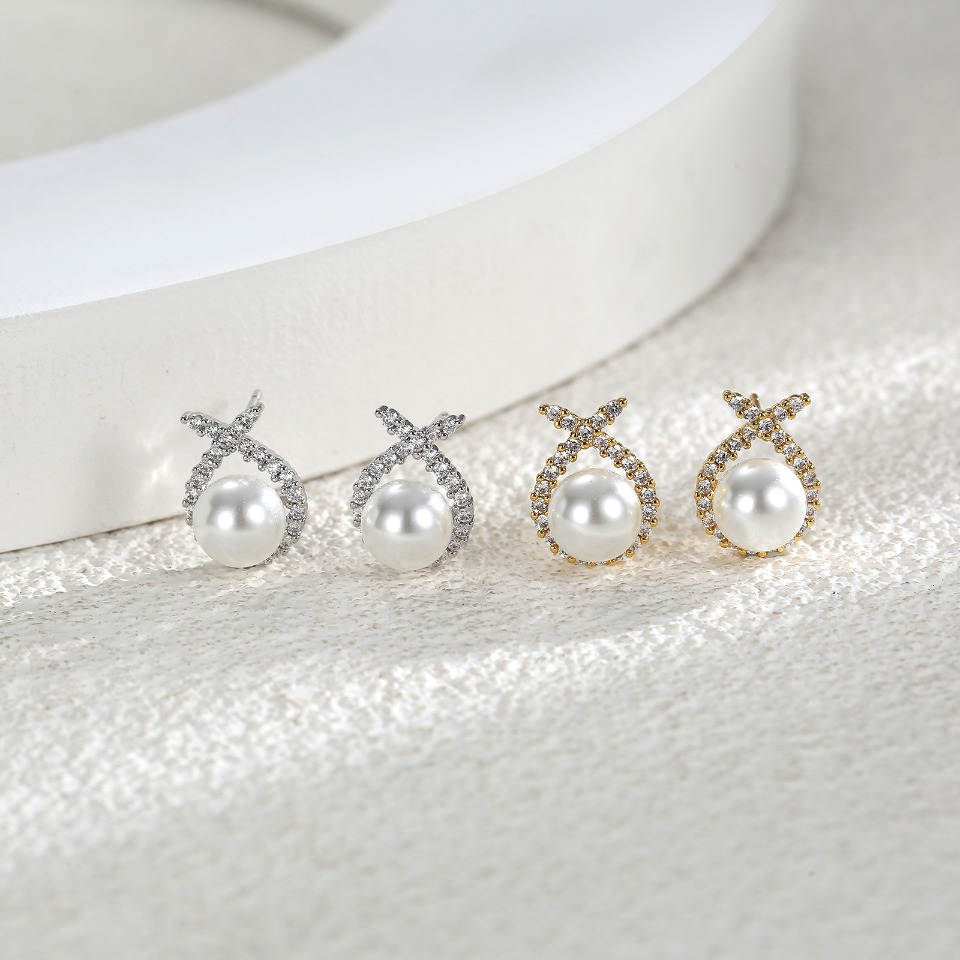Elegant Pearl & Cubic Zirconia Earrings with Gold - Plated Twisted Design