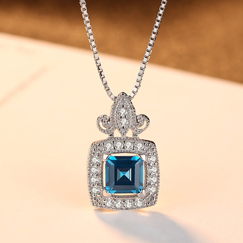 Sterling Silver Princess Cut Blue Topaz Pendant Necklace with Crown Design