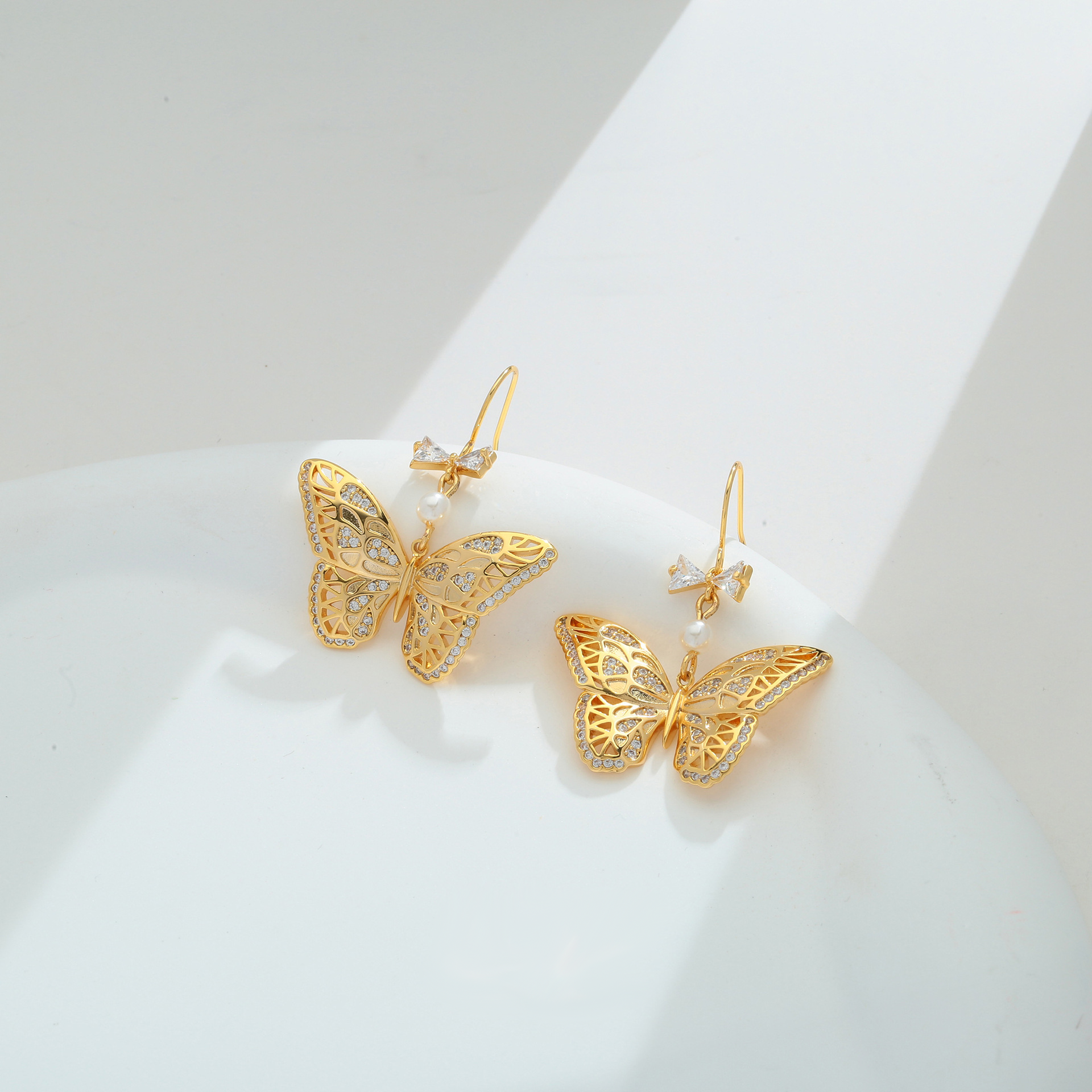 Elegant Gold-Tone Butterfly Drop Earrings with Crystals and Simulated Pearl in Copper