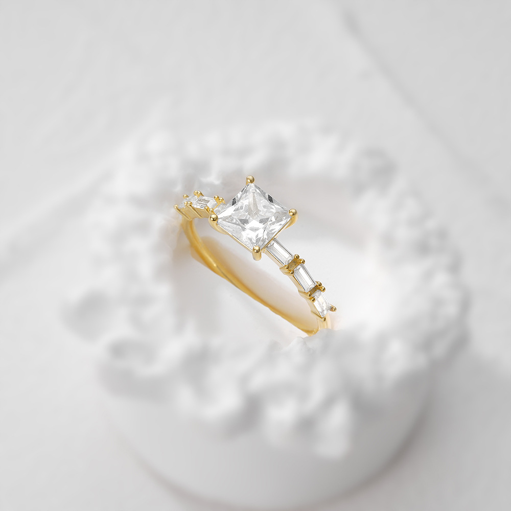 Sterling Silver Princess Cut Halo Ring with Tapered Baguette Side Stones