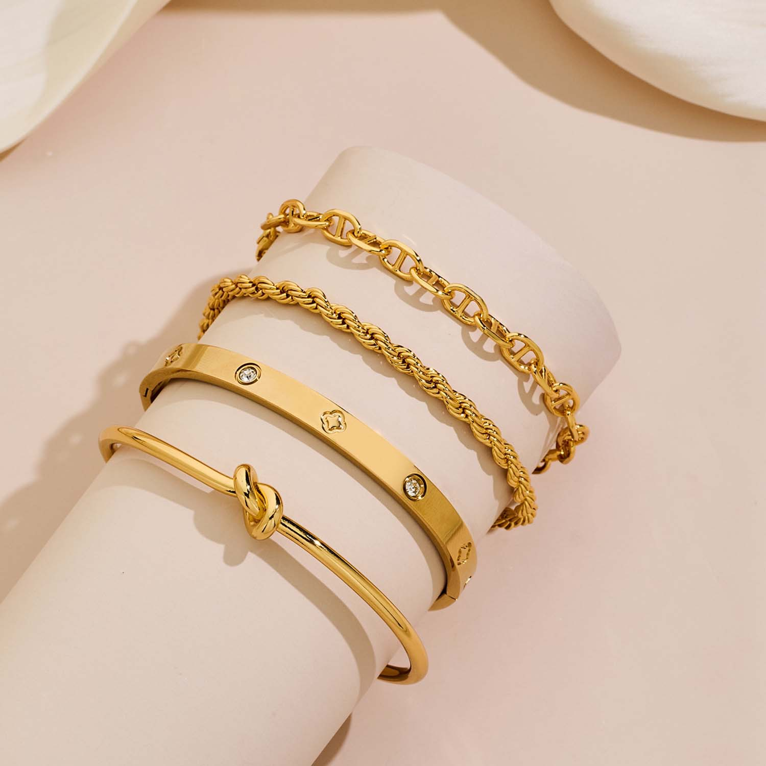 4-Piece Gold Plated Copper Bangle Set - Mixed Styles: Love Knot, Diamond Accent, Braided & Paperclip Cuff Bracelets for Women
