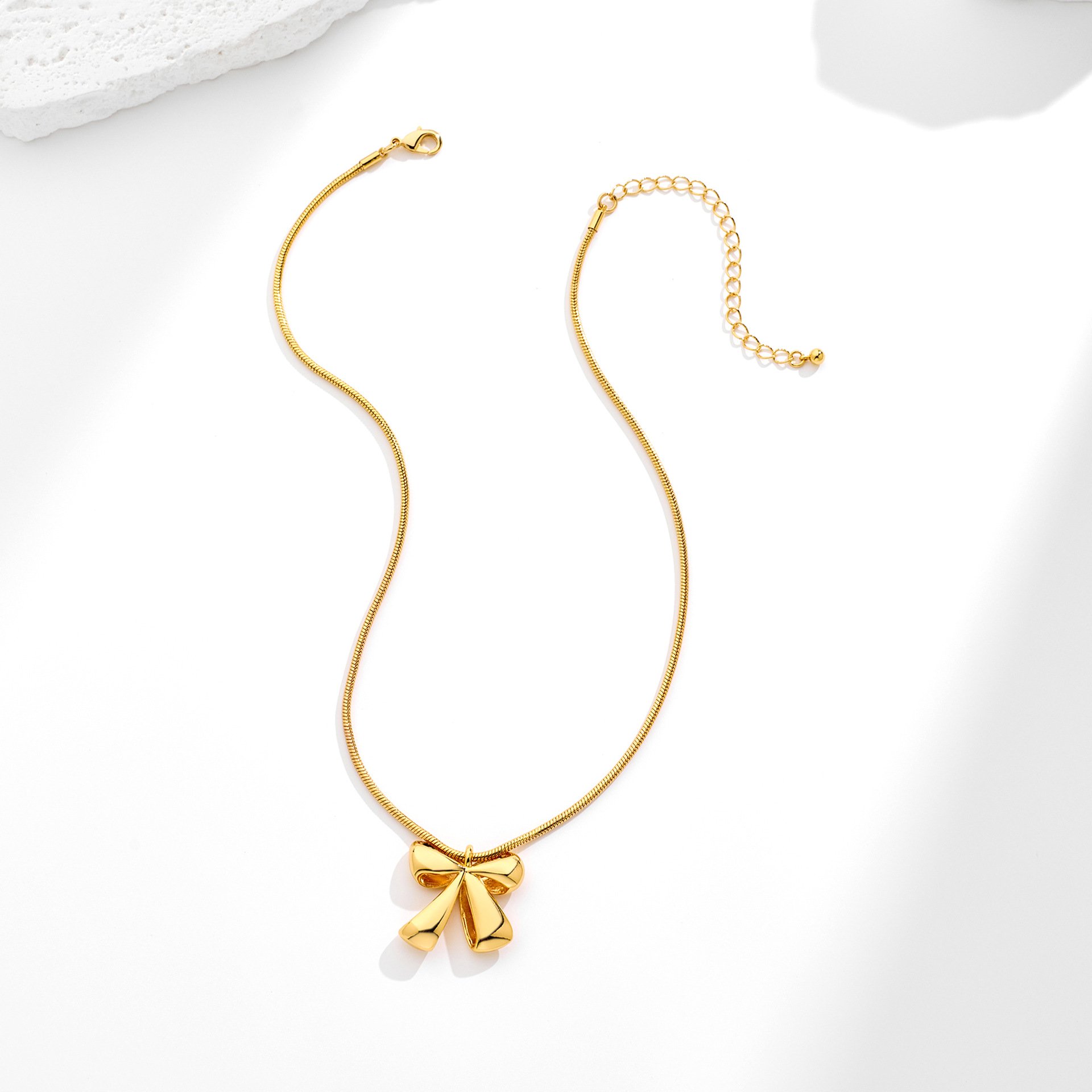 Elegant Gold-Plated Brass Bow Pendant Necklace with Snake Chain