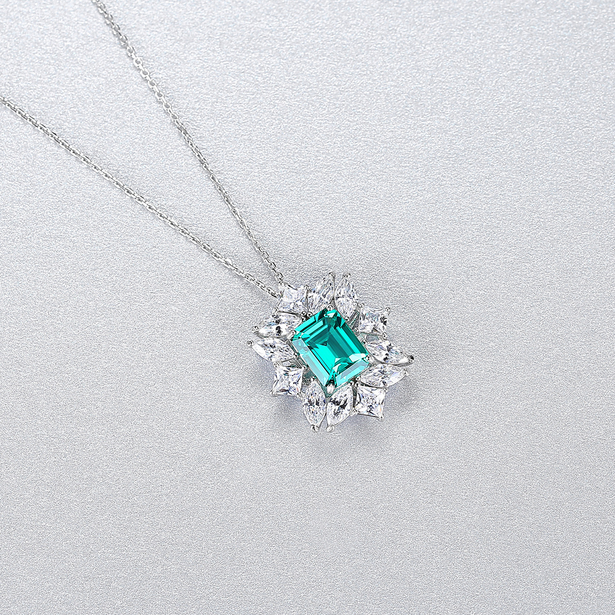 Sterling Silver Emerald Cut Turquoise Pendant Necklace with Marquise Cluster Halo