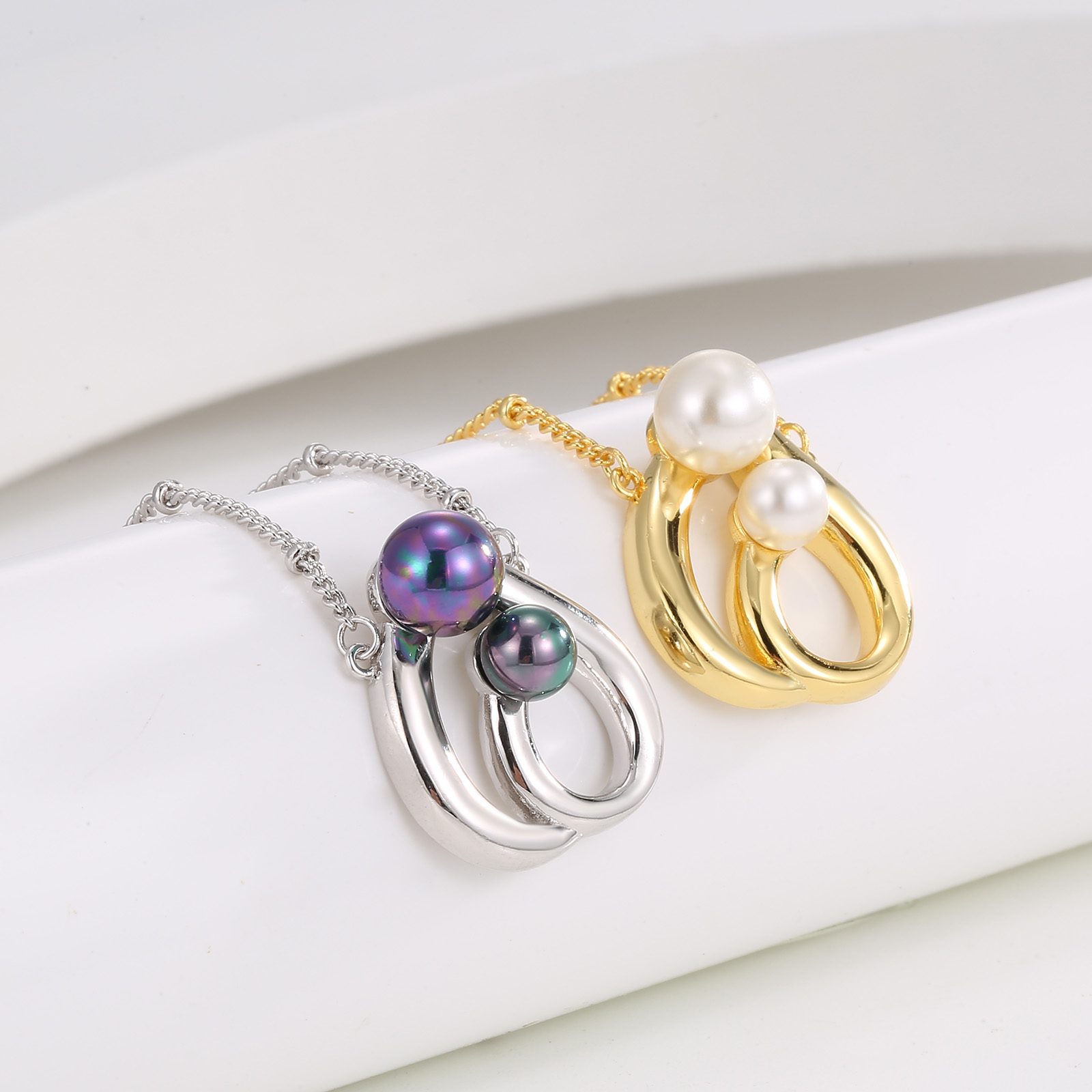 Elegant Gold-Tone Double Pearl Pendant Necklace with Twisted Design