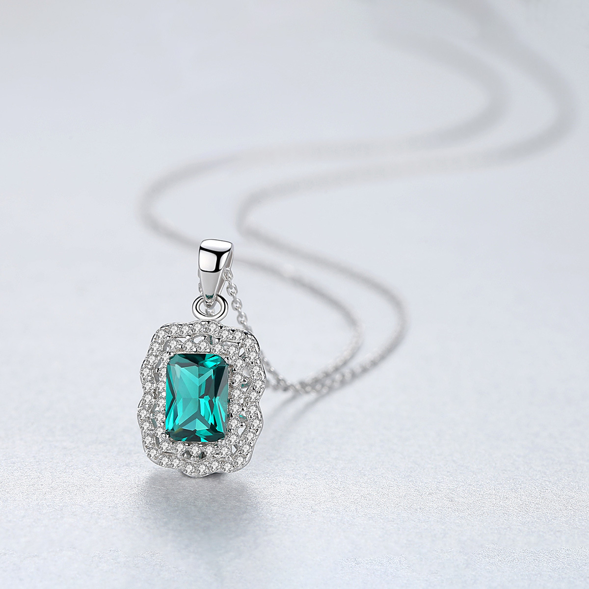 Sterling Silver Emerald Cut Teal Blue Pendant Necklace with Double Halo