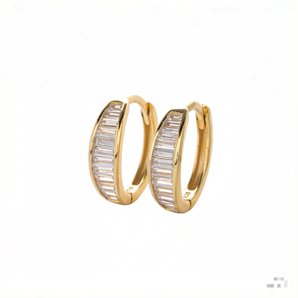 These sophisticated gold hoop earrings feature a sleek design with baguette