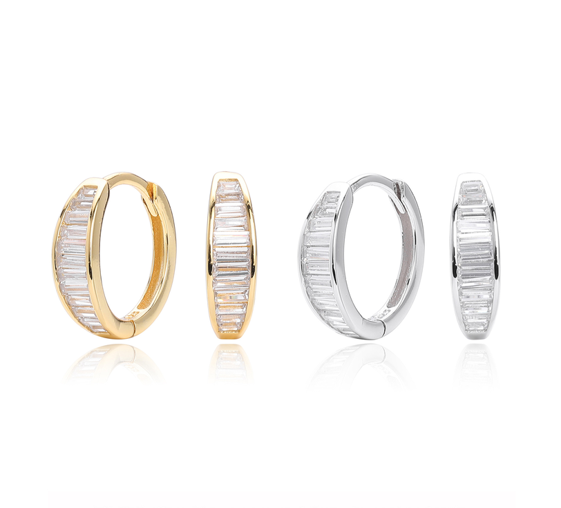 These sophisticated gold hoop earrings feature a sleek design with baguette