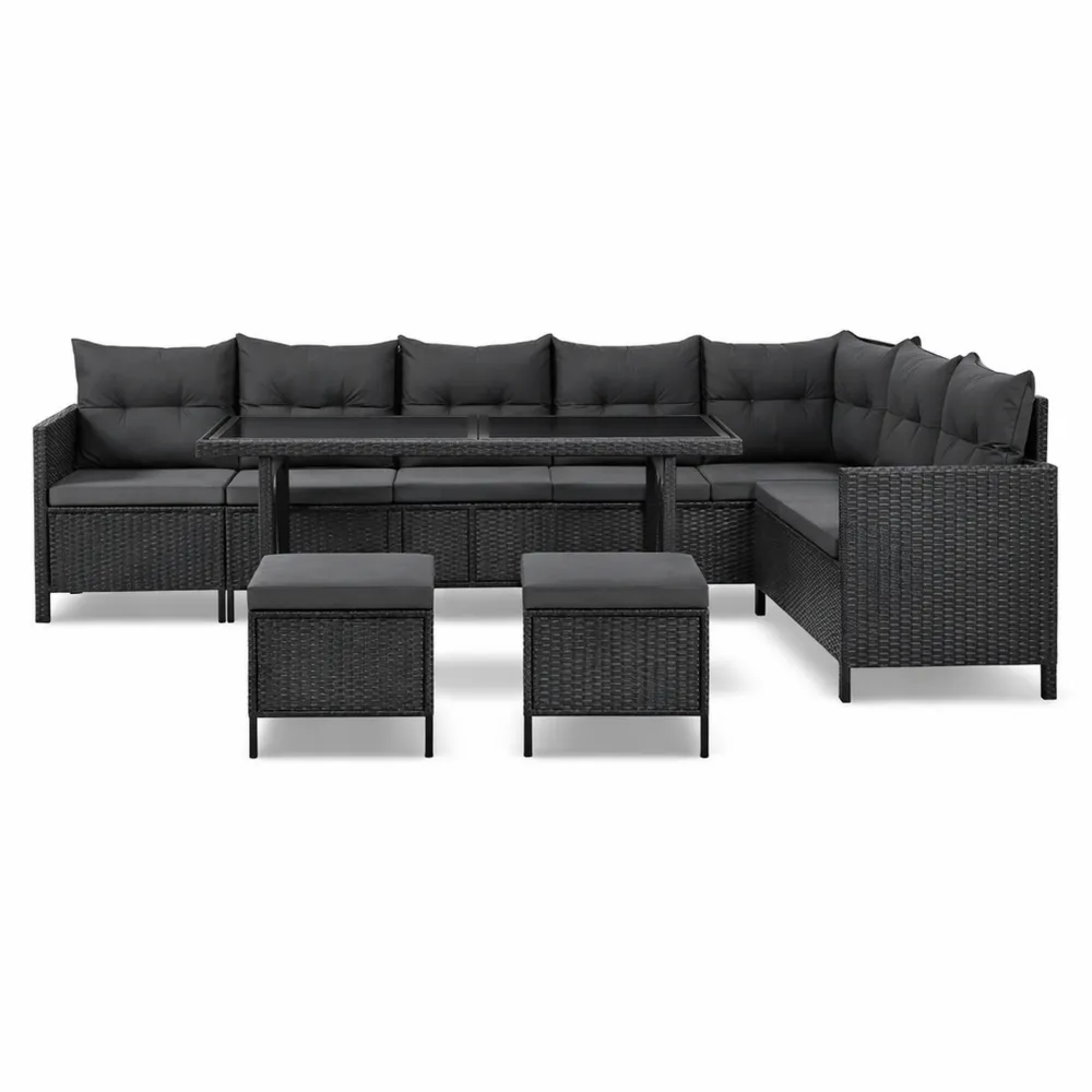 Set lounge da giardino in polyrattan nero per 7 persone con divano, tavolo e sgabelli
