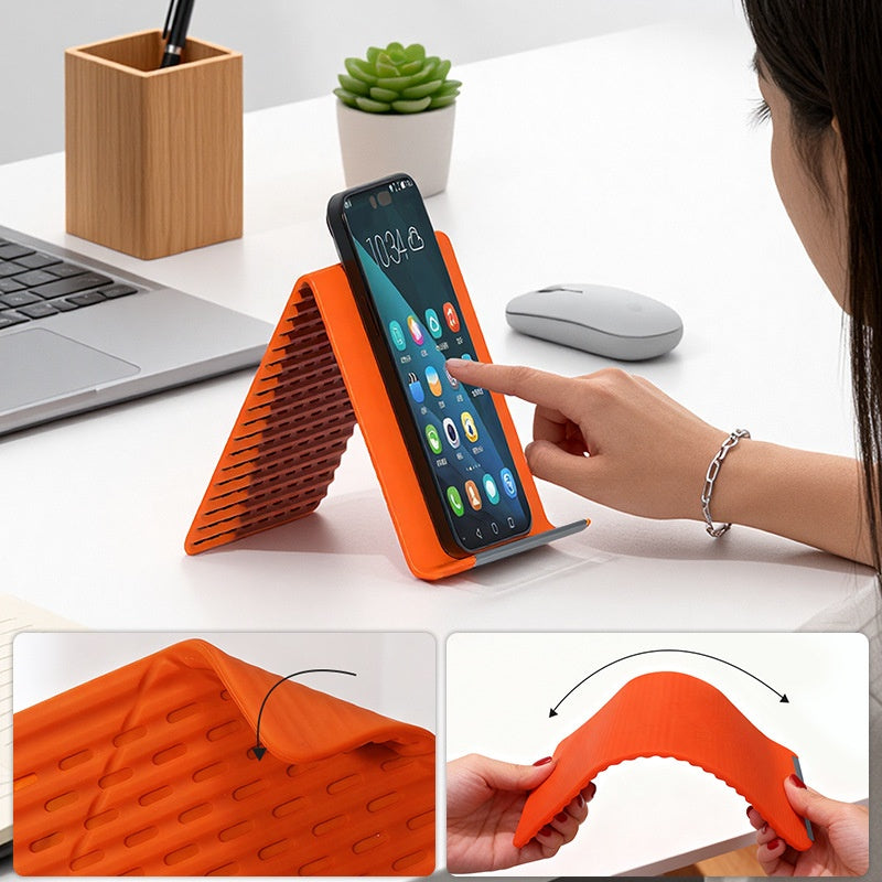🥳2026 HOT SALE🥳💞50K+ SOLD!🛋️✨ 50% OFF! Silicone Foldable Stand – Shape it your way, reduces neck pain. Ultra‑portable, anti‑slip. Work, cook or watch hands‑free. A small stand, big relief.📱🛡️