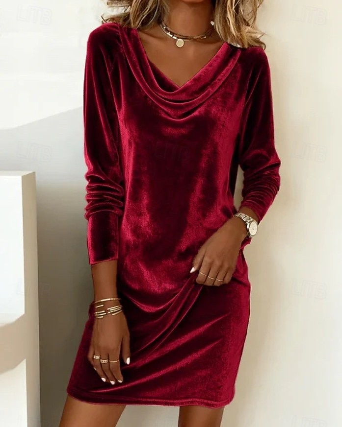 This women's velvet dress with a cowl neck exudes elegance and sophistication.