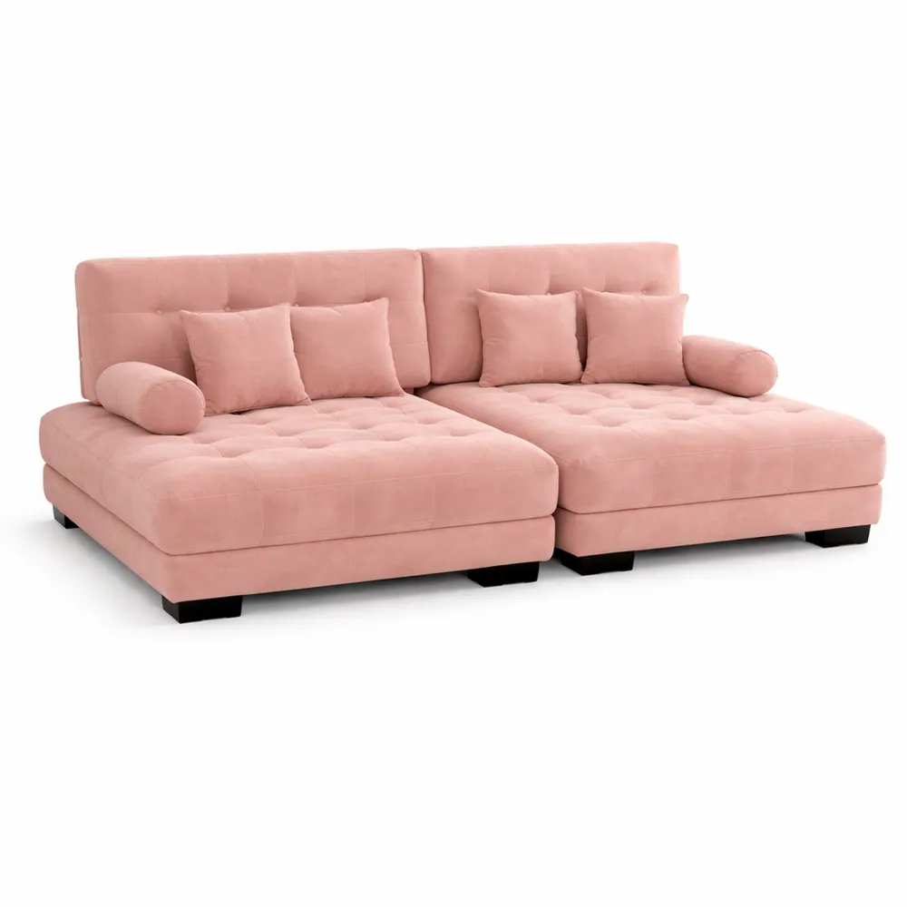 Divano angolare in ciniglia con cuscini decorativi e ottomani