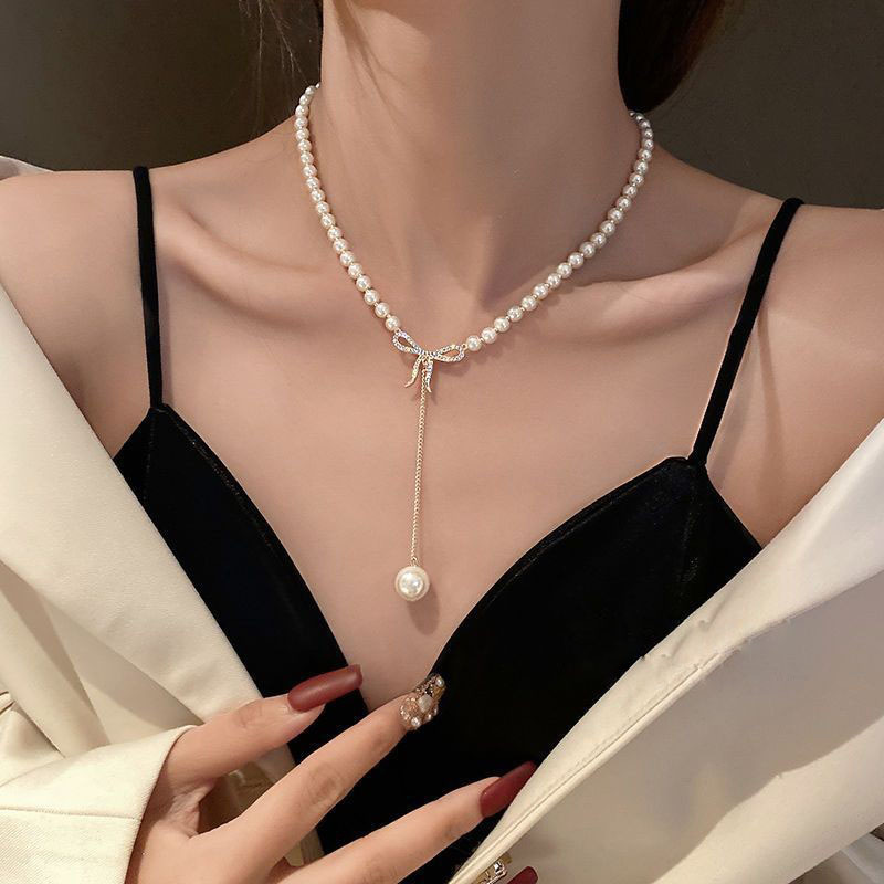 Elegant Pearl Necklace with Zirconia Bow
