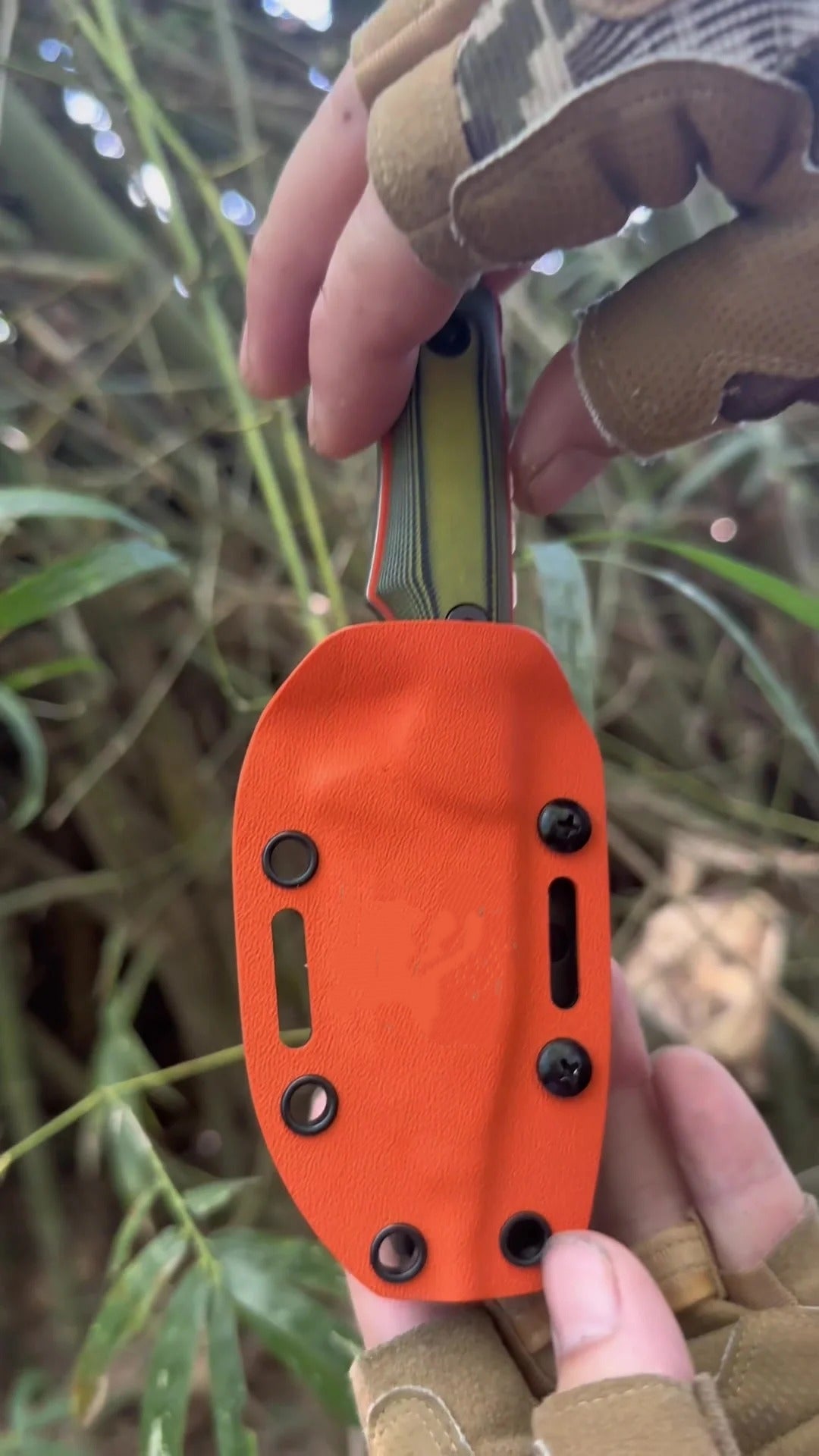 Customer using the orange sheath outdoors