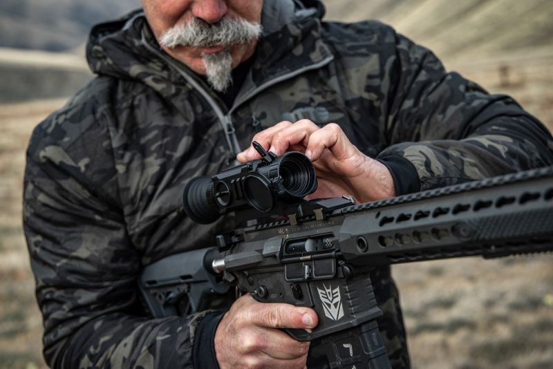 Hunter adjusting the Ocelot 256 Thermal Imaging Scope.
