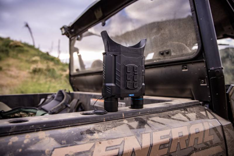Harrier Thermal Imaging Binocular resting on a side-by-side.