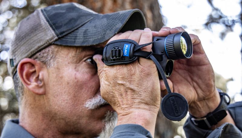 Hunter glassing through a Bobcat Thermal Imaging Monocular.