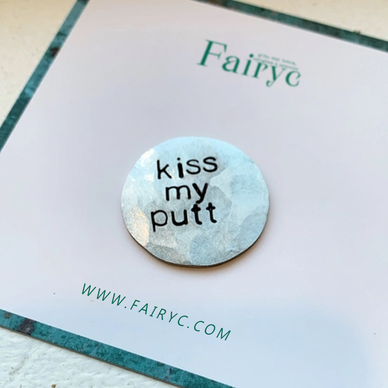 Fun hand embossed golf ball marker
