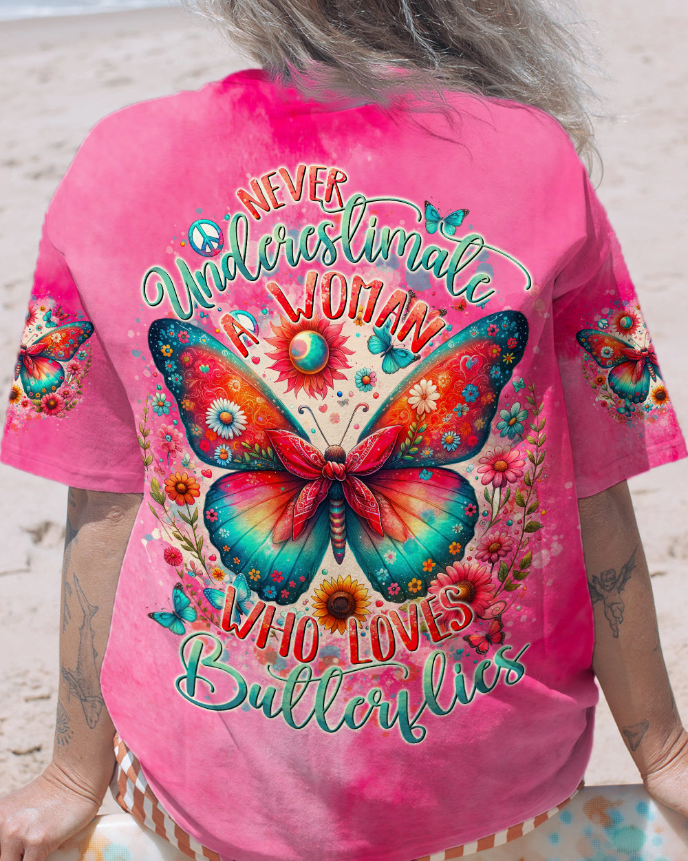 NEVER UNDERESTIMATE A WOMAN WHO LOVES BUTTERFLIES ALL OVER PRINT - TYTD1106244