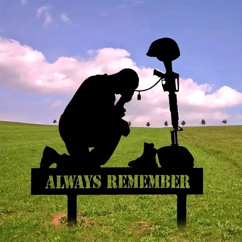 Memorial metal plaque for fallen soldiers, yard