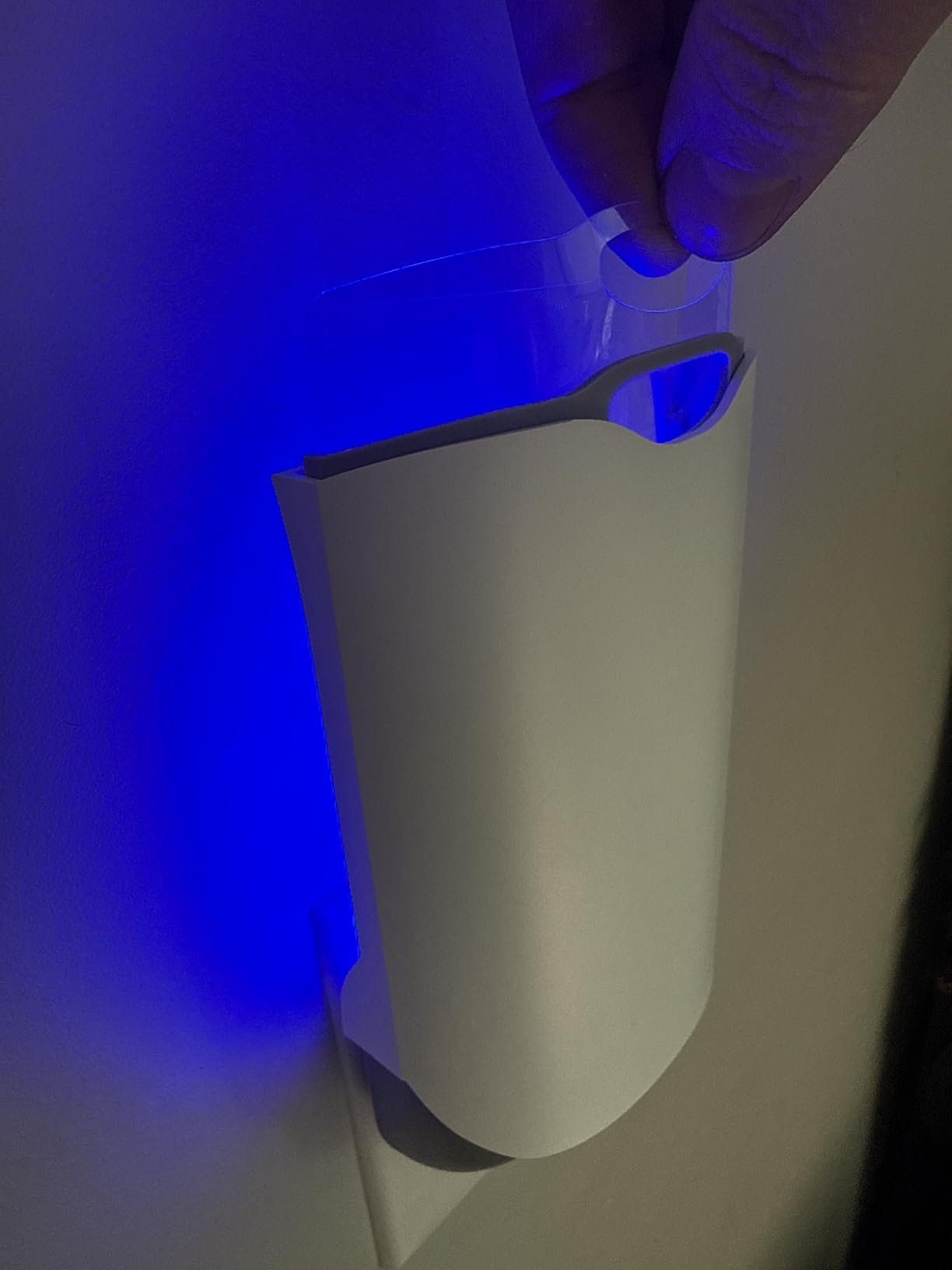 Takes up two outlets, comes with extra sticky pads