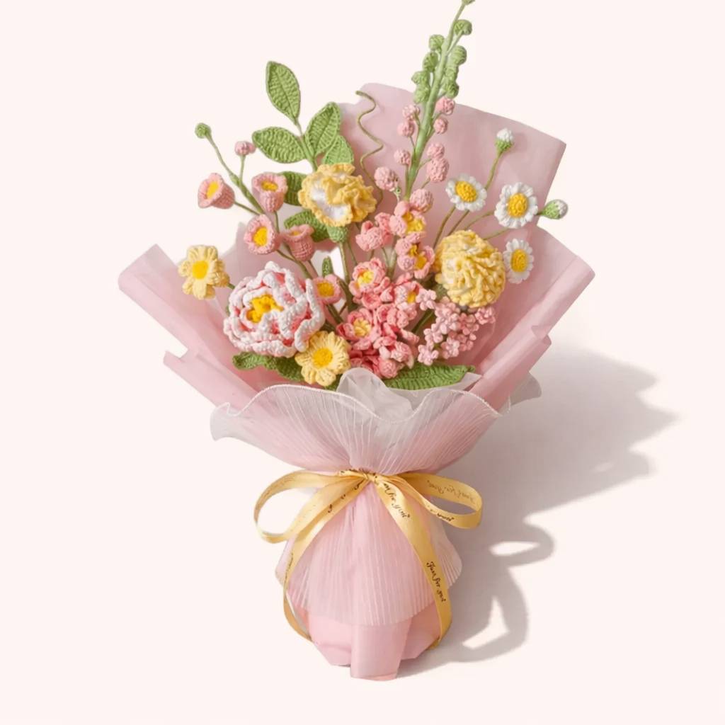 Crocheted bouquet containing daisies, roses and pink carnations