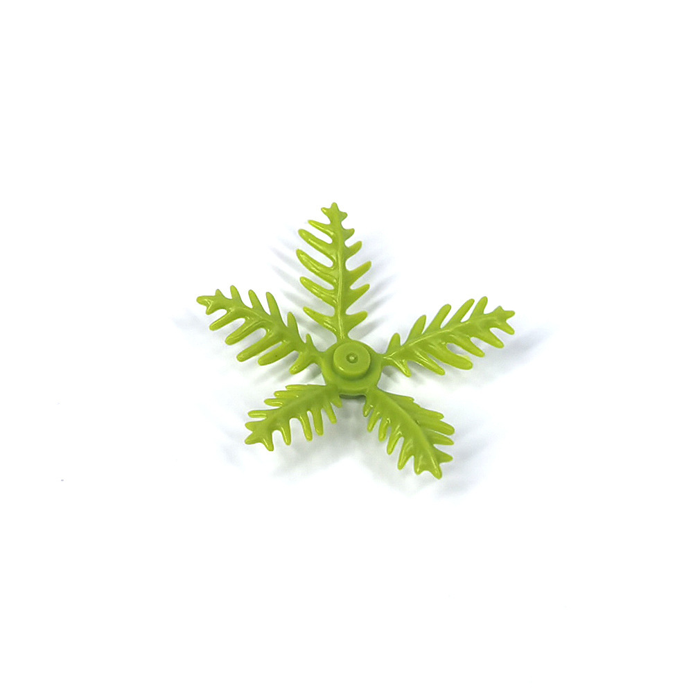 Kleine plastic bouwblokjes, kleine kokosbladeren, palmbladeren van de kust