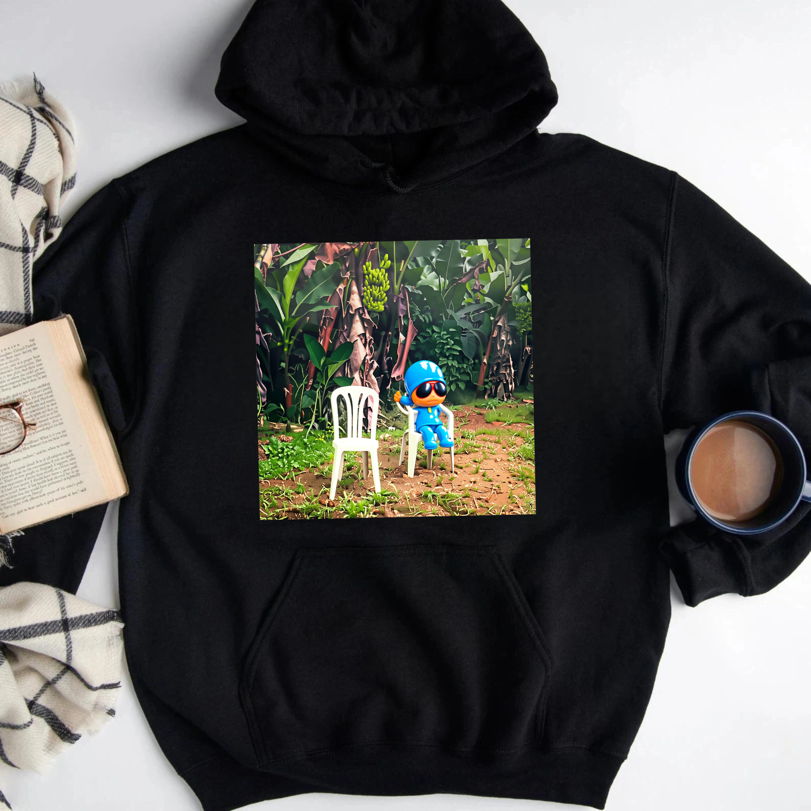 Blue Cartoon Character Sitting On White Chair In Tropical Garden Sweatshirt