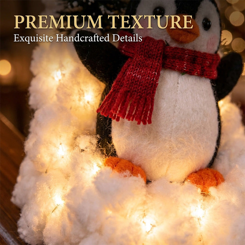 Close-up of the festive penguin decoration and its soft snowy base